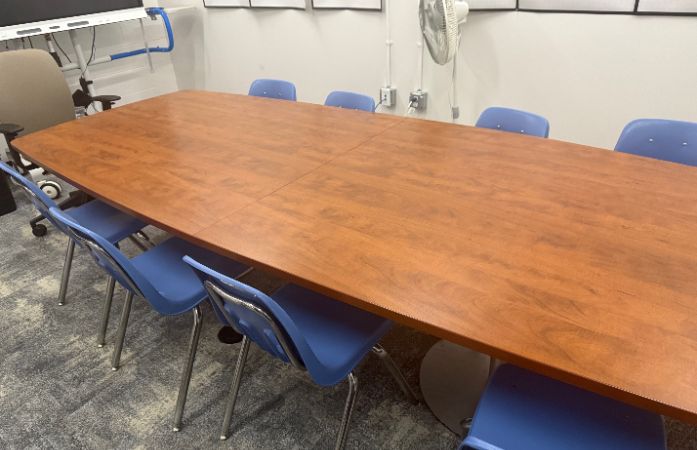  A conference rooms with empty seats eagerly waiting for parents to take a seat